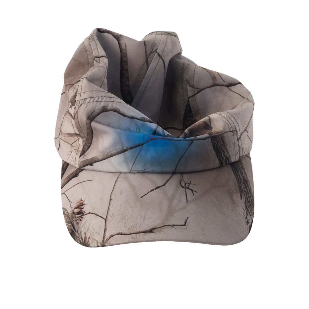 Camouflage-patterned cap with a blue graphic placed in the center on a white background
